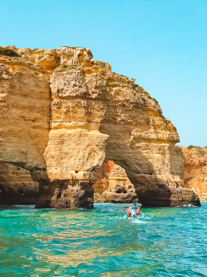 Elephant shaped rock surrounded with blue water