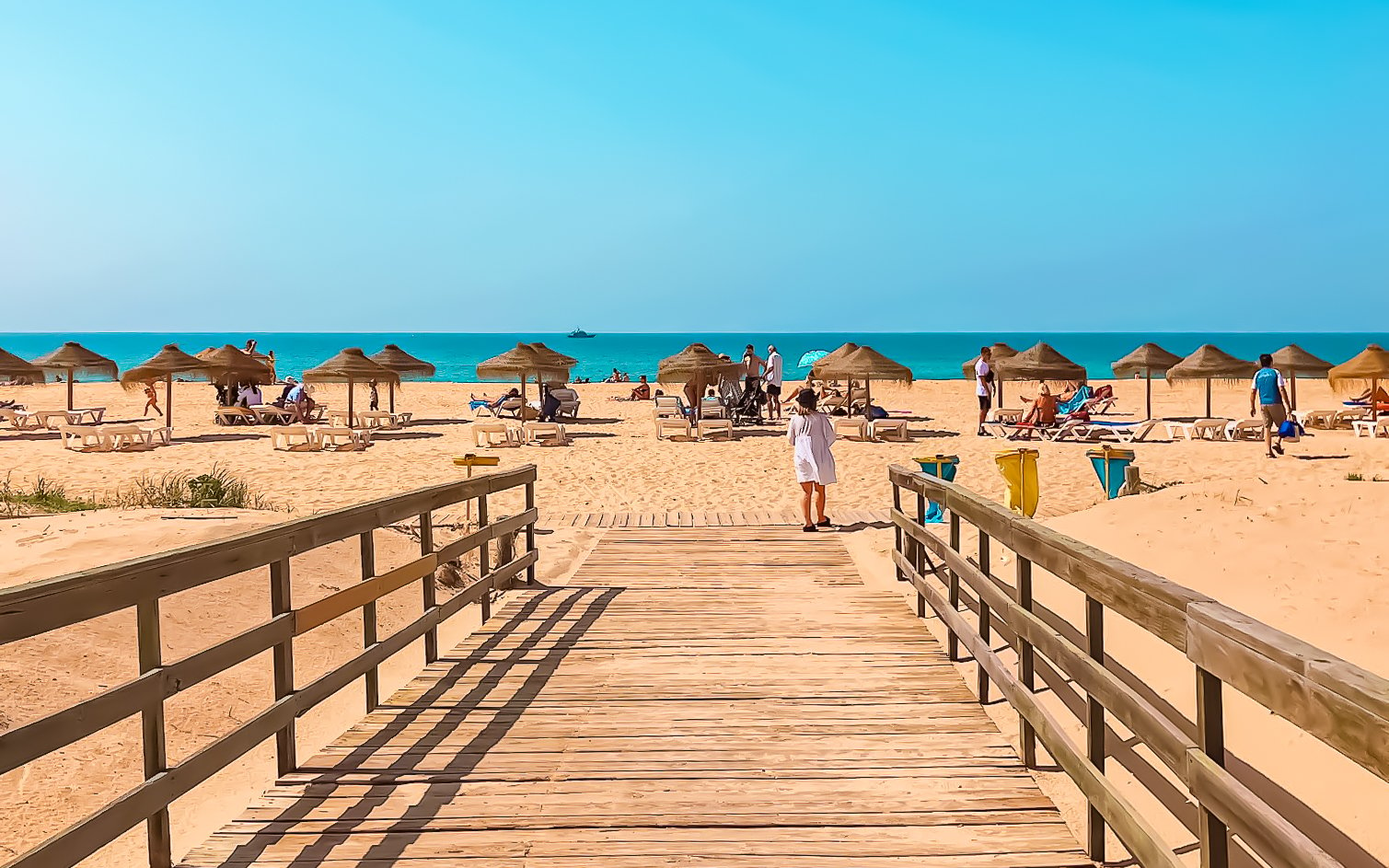 Boardwalk and umbrellas at Praia da Rocha Baixinha