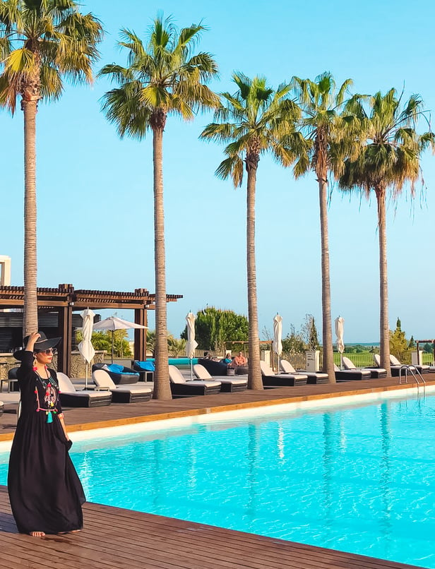 Muslim blogger beside pool at Anantara Vilamoura