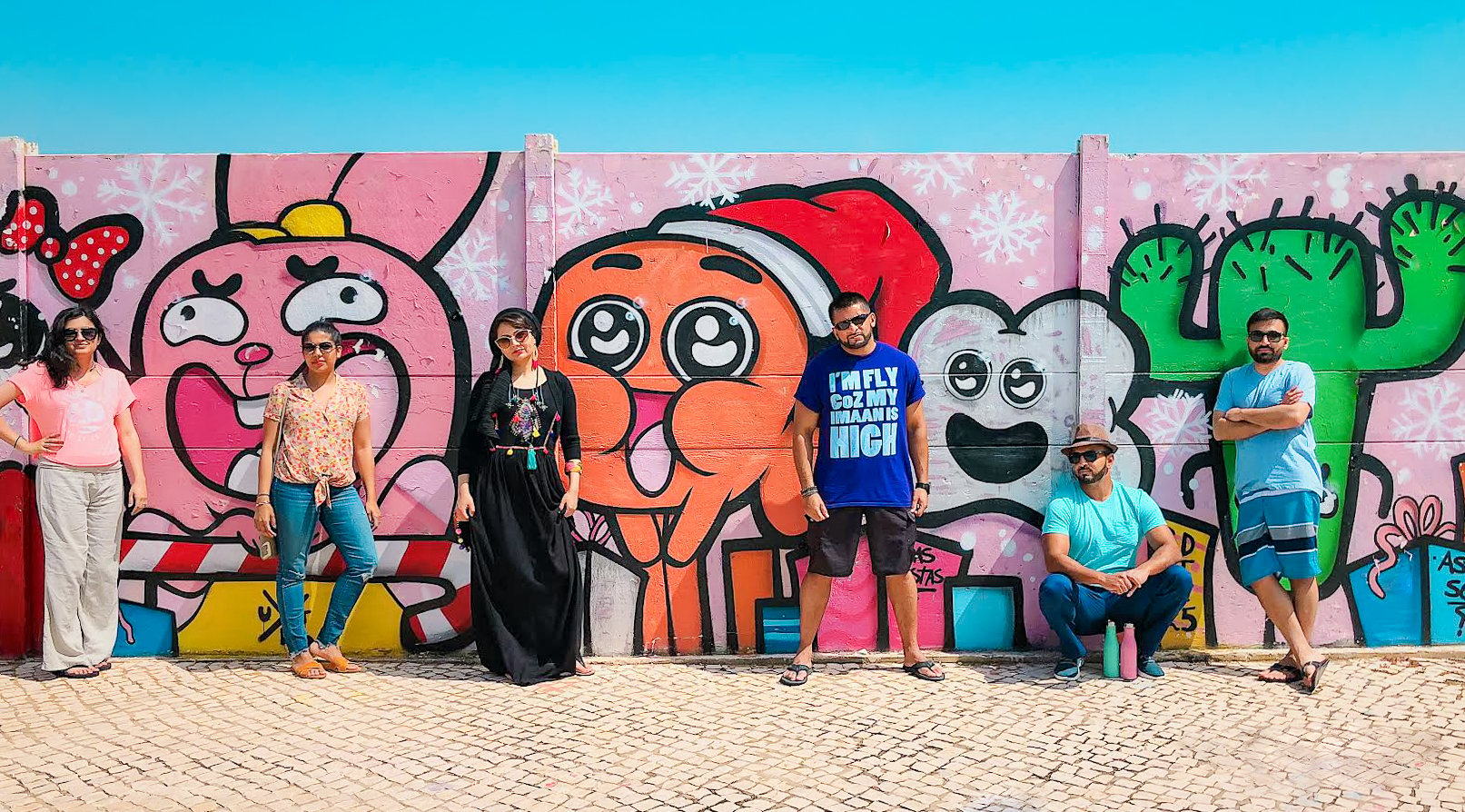 Muslim friends with graffiti wall in Algarve