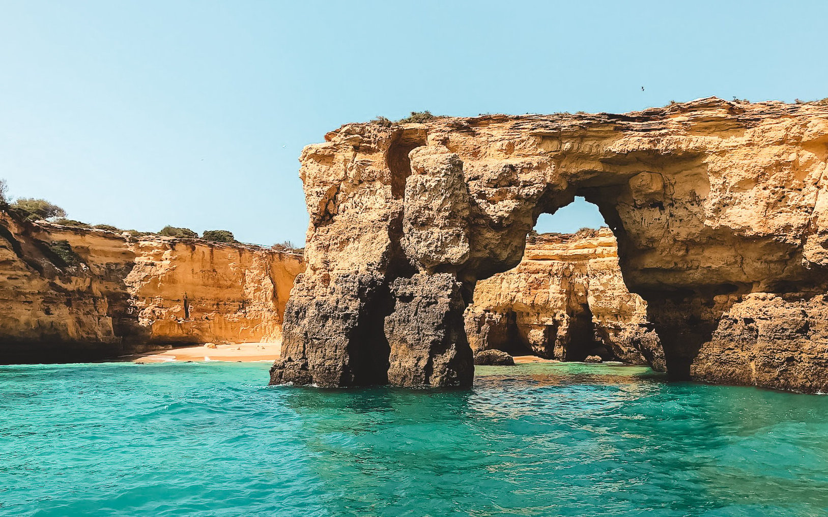 Sea arch surrounded by blue water