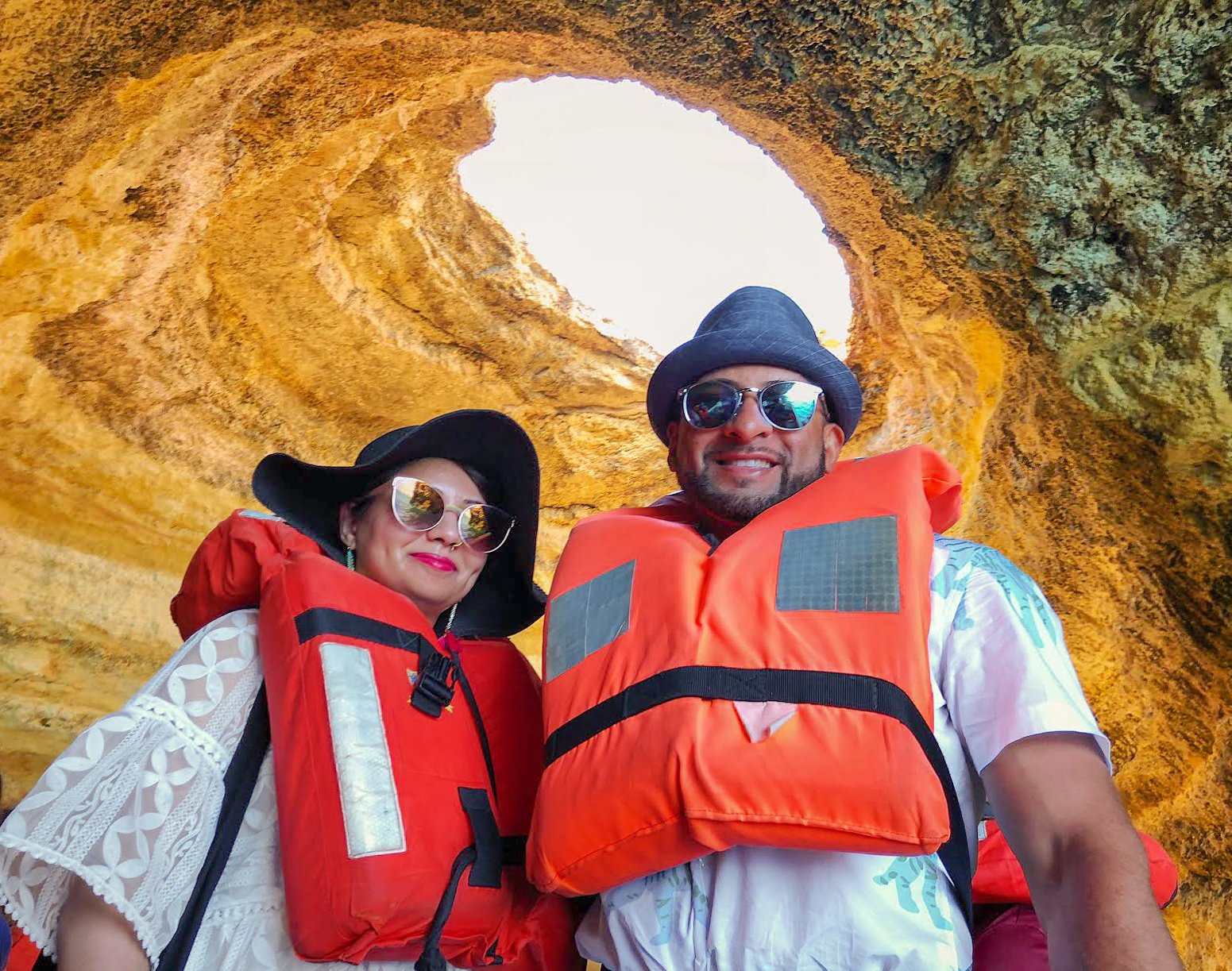 Muslim couple wearing life jackets in Benagil cave