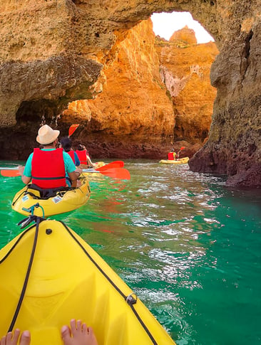 Muslim friends kayaking in Lagos through caves