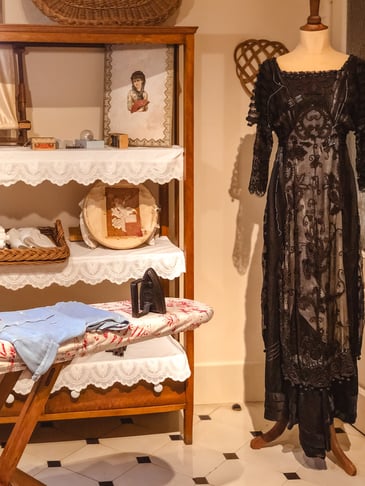 Black dress and ironing board inside Casa Mila apartment