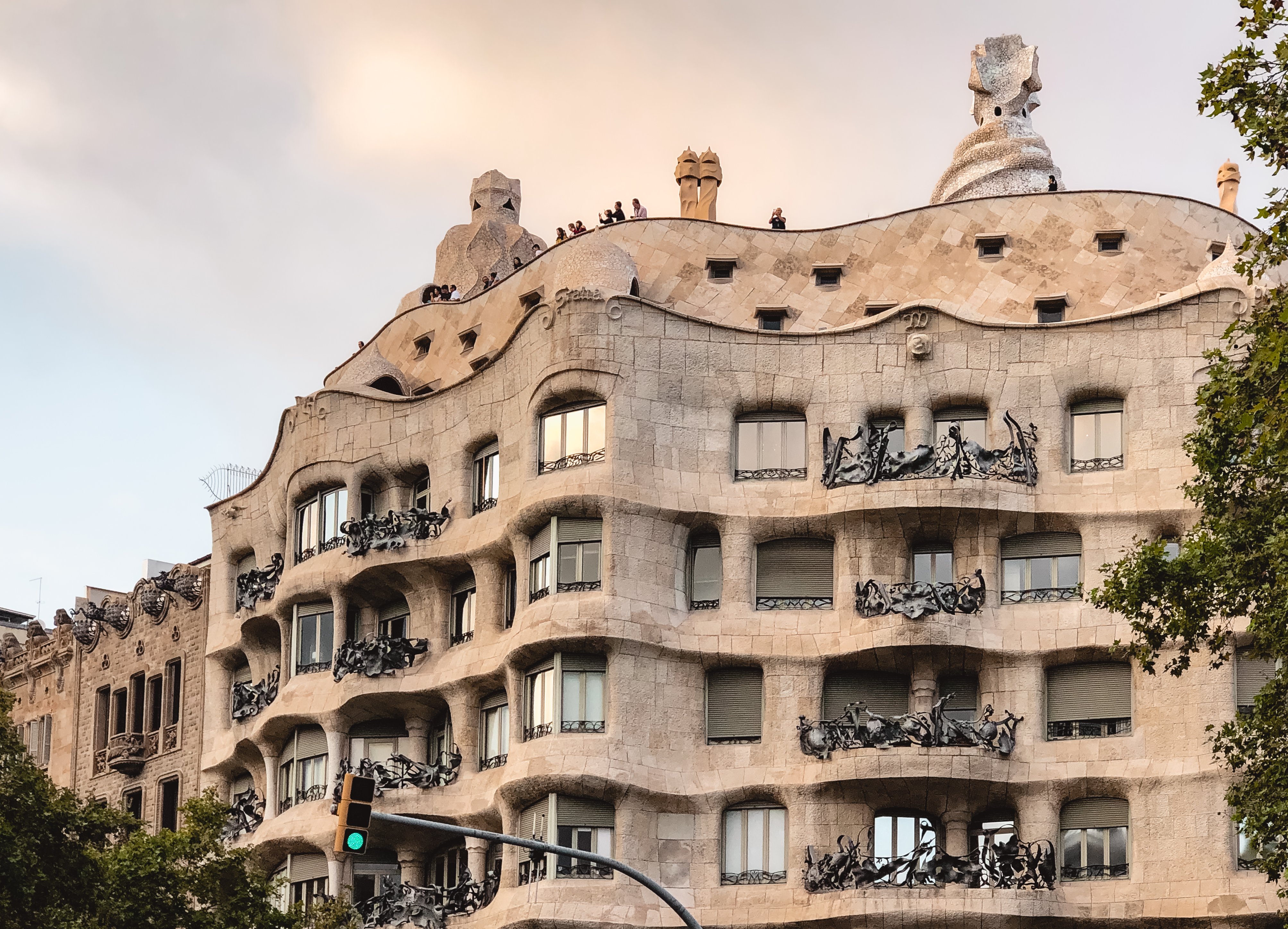 Stone facade of Casa Mila at sunset