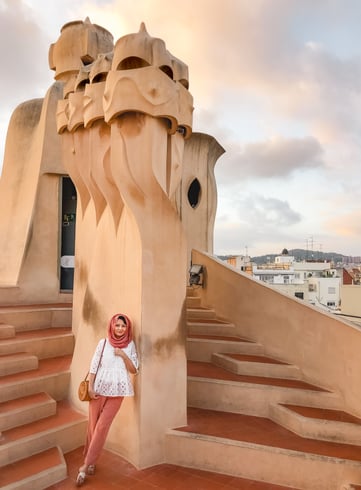 Hijabi leaning against warrior chimney at Casa Mila