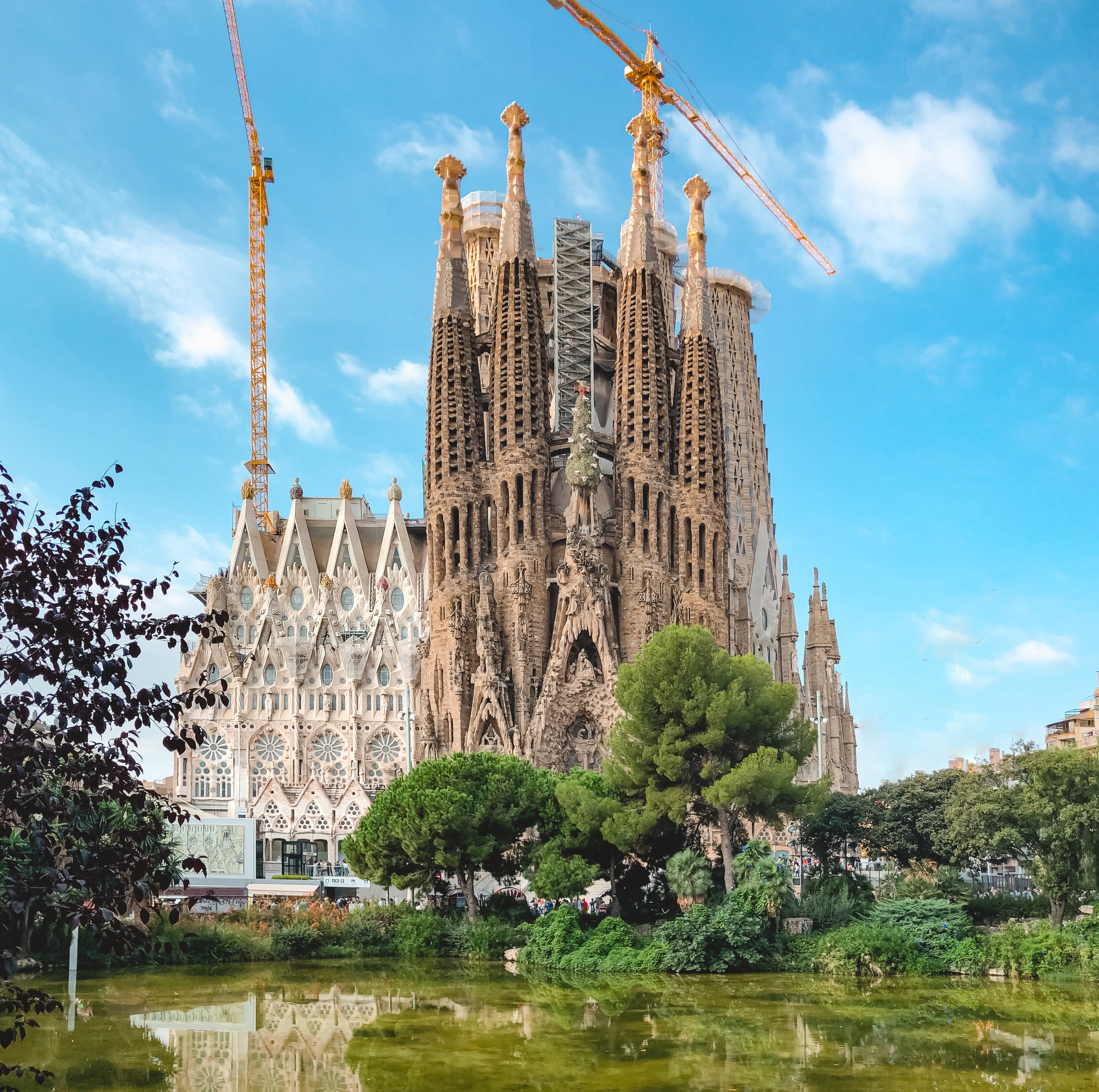 Sagrada Familia surrounded by trees and lake