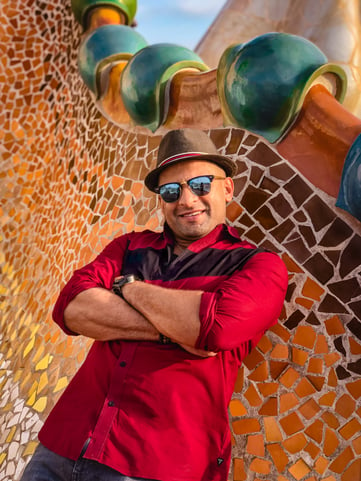 Portrait of smiling man on Casa Batllo rooftop