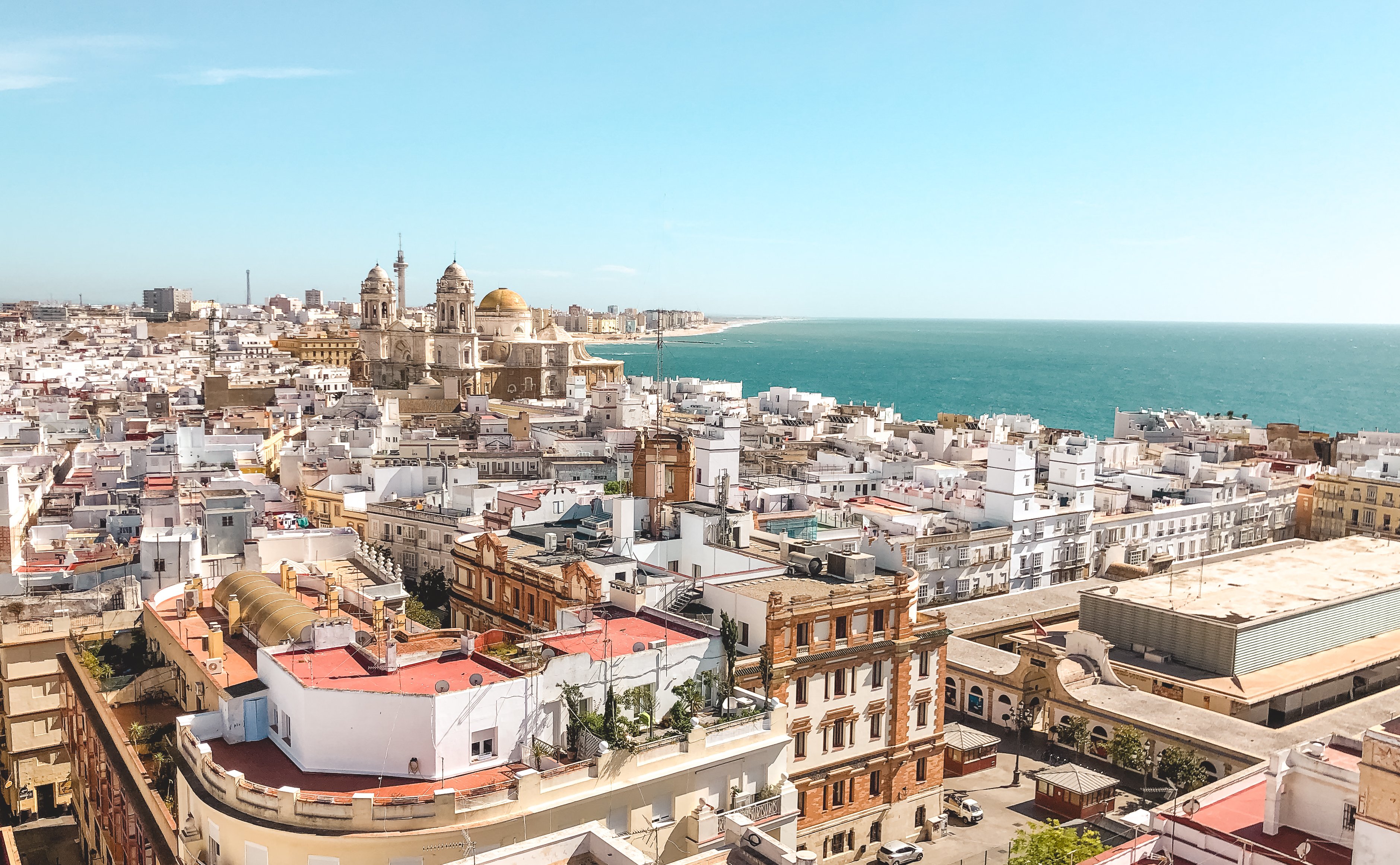 White buildings and Cadiz cathedral along the coast