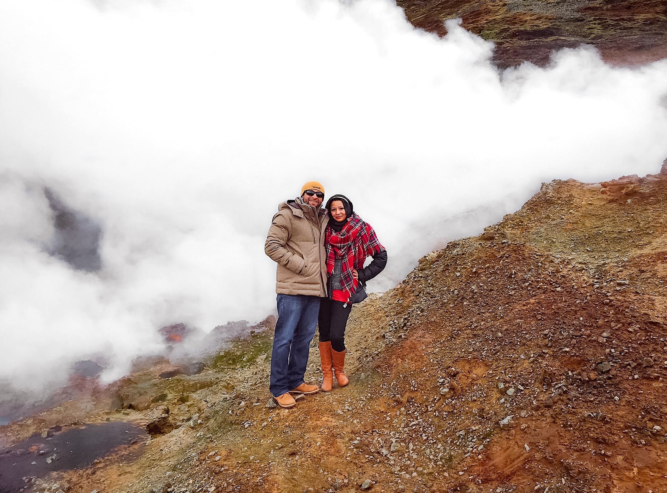Muslim travel couple on active volcano