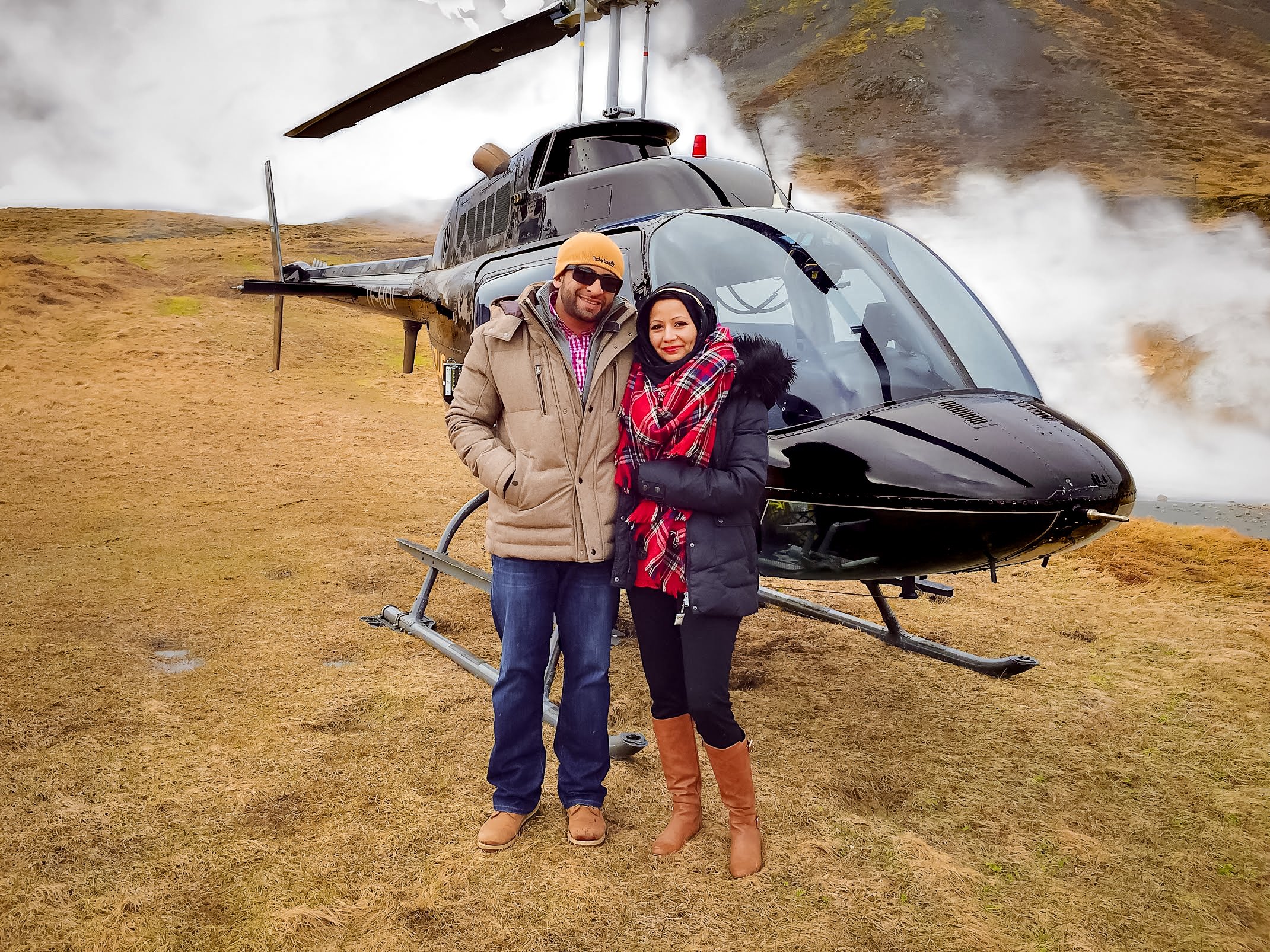 muslim travelers on volcano with black helicopter