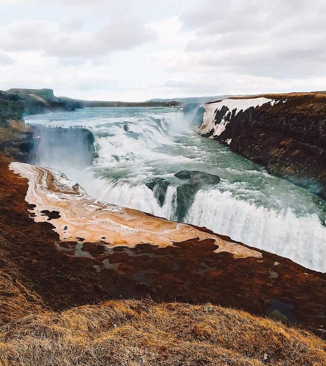 Gullfoss flowing waterfall in canyon