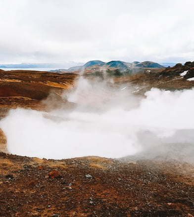 White steam of active volcano