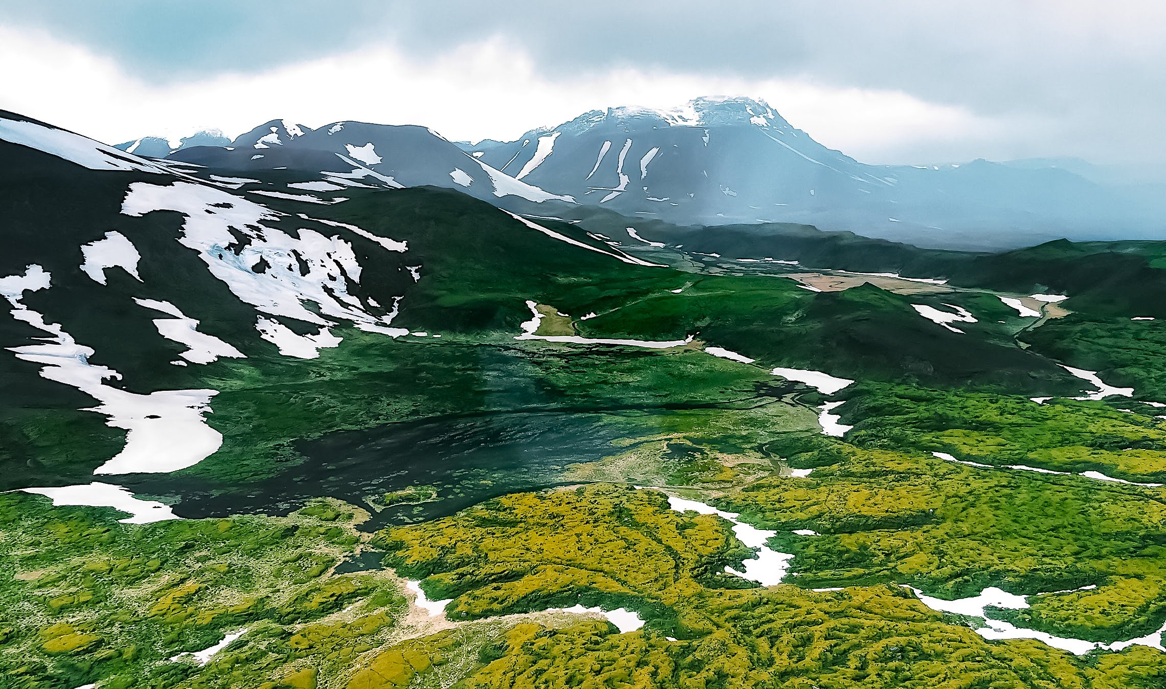 Green mountains dusted with snow