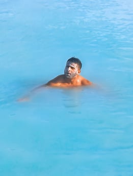 Man with face mask in Blue Lagoon