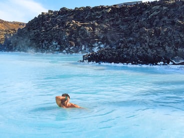 man kissing his muscle in Blue Lagoon