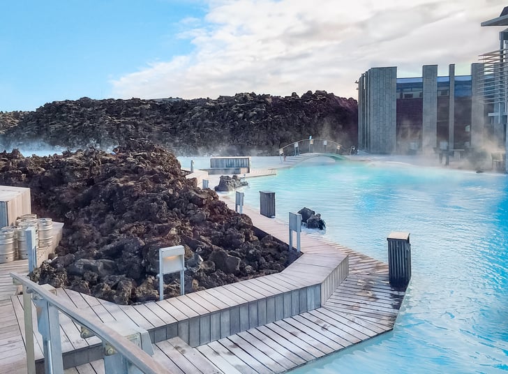 Blue Lagoon surrounded by black lava rocks