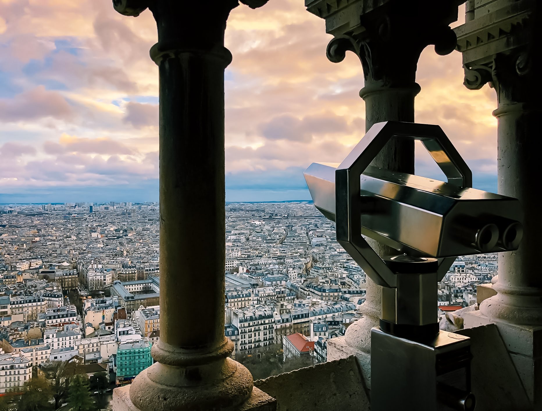 tower viewer showing Parisian skyline at sunset