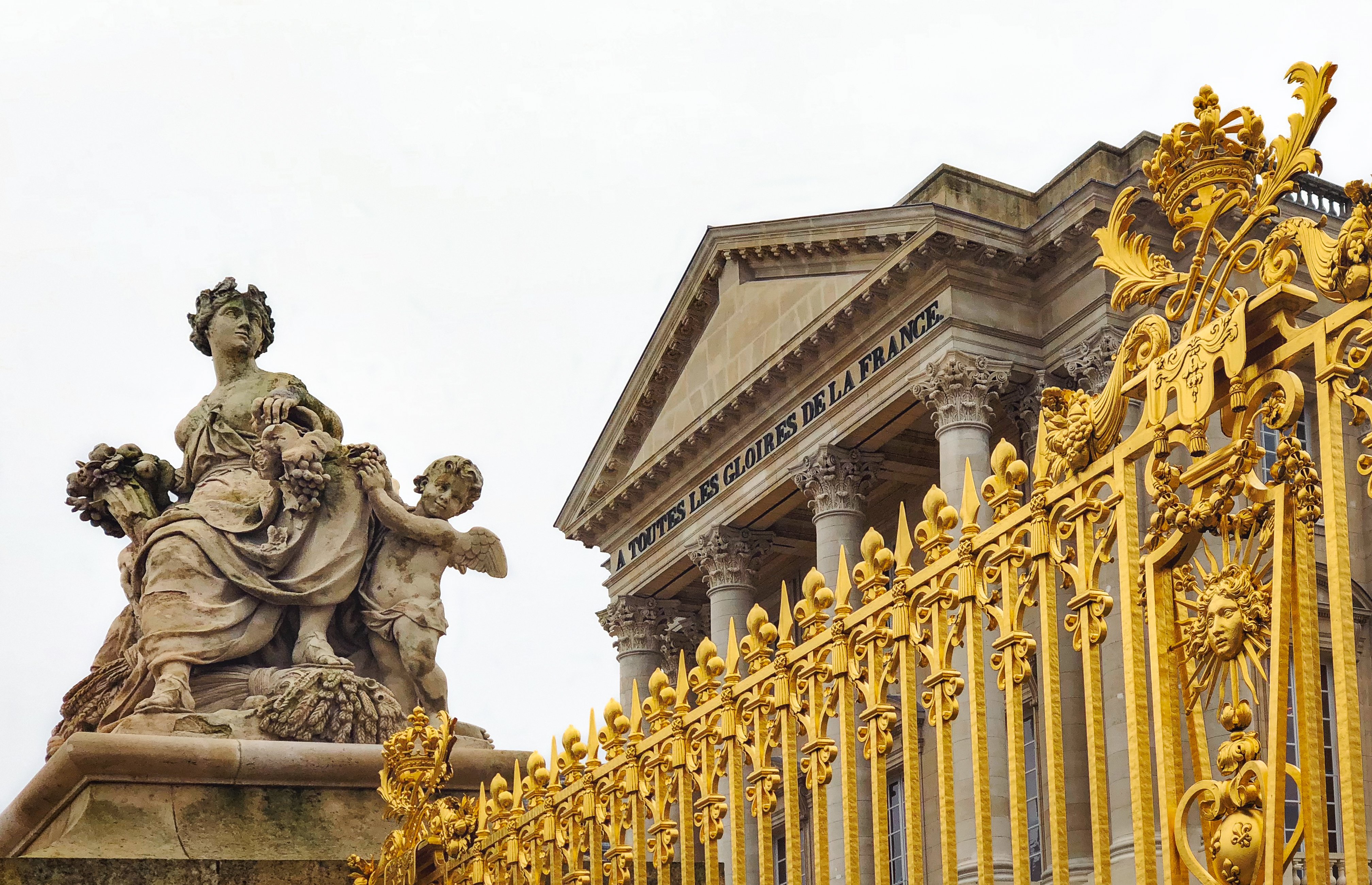 Statues and golden gate of Palace of Versailles