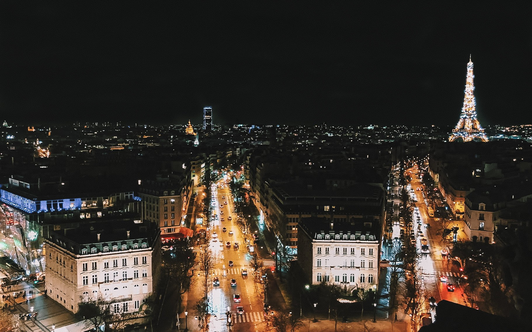 Parisian skyline at night and Eiffel tower lightshow