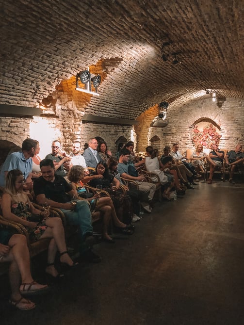 People seated in cave venue for flamenco show Seville