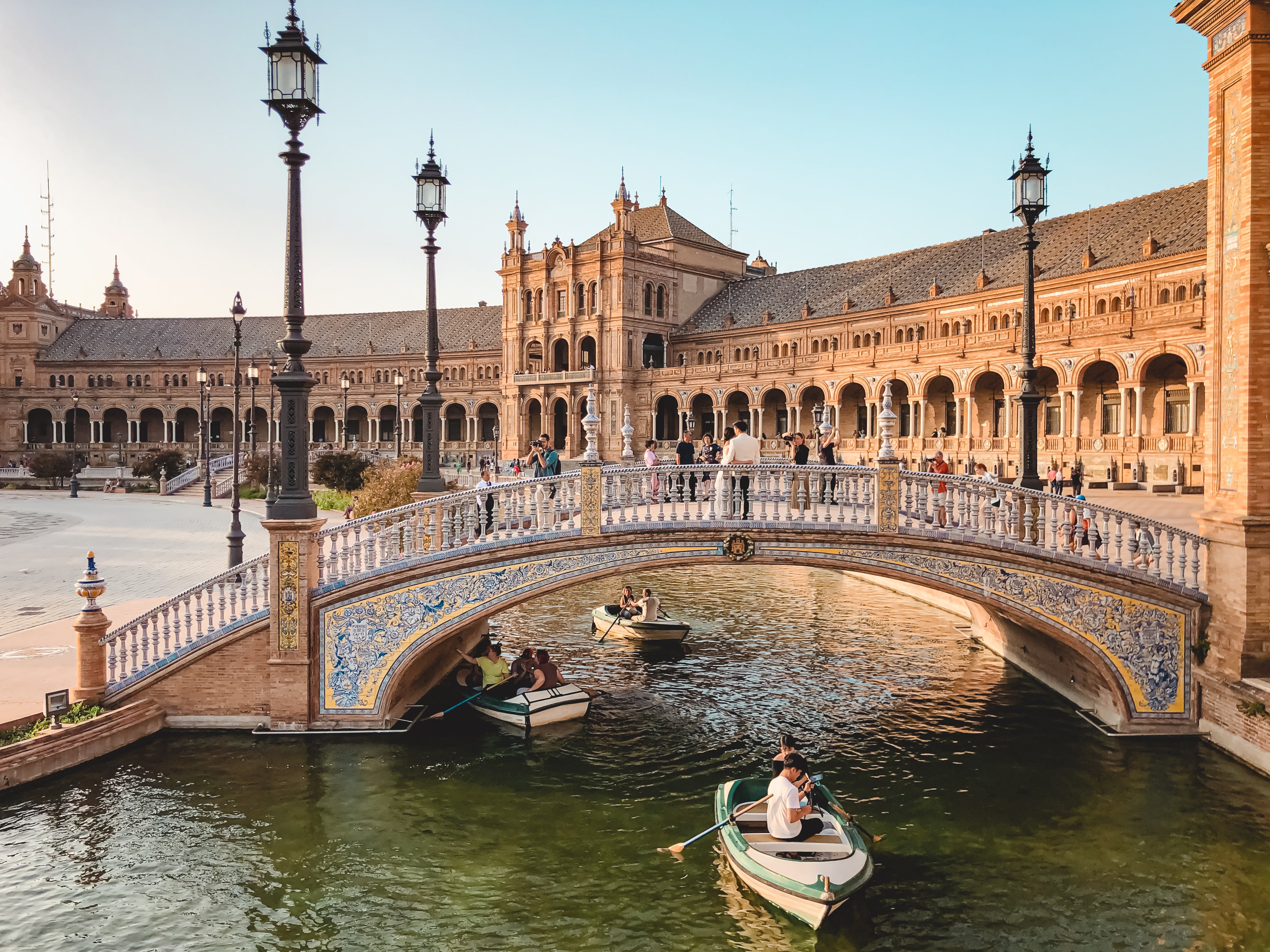 Rowboats in canal with bridge at Plaza de Espana Seville