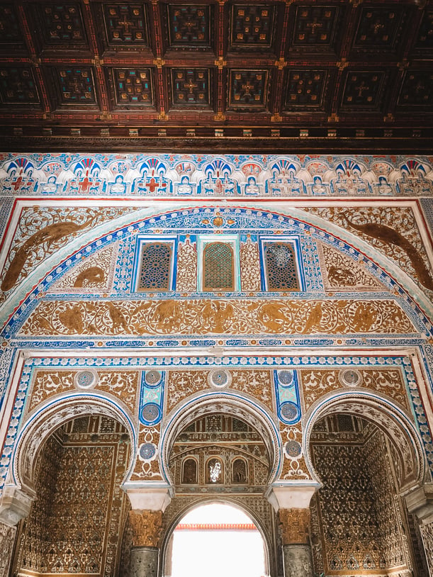 Gold domed ceiling surrounded by muqarnas Seville Alcazar