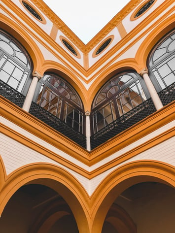 Seville Alcazar black windows and yellow arches