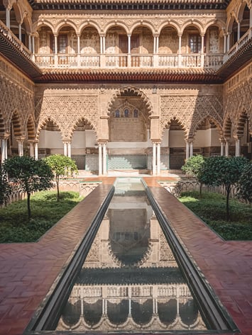 Reflecting pool and sunken garden in Seville Alcazar courtyard