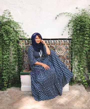 Muslim woman wearing blue dress in Moorish courtyard in Seville