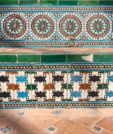 Blue and green Moorish tiles in Seville garden