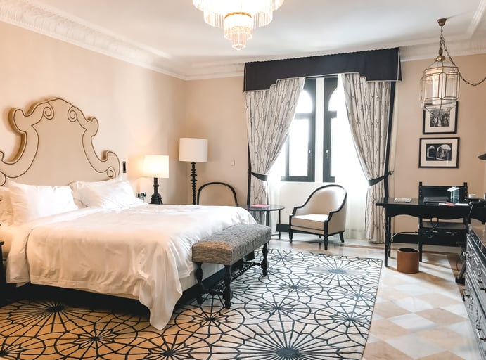 Cream colored bedroom in Seville hotel